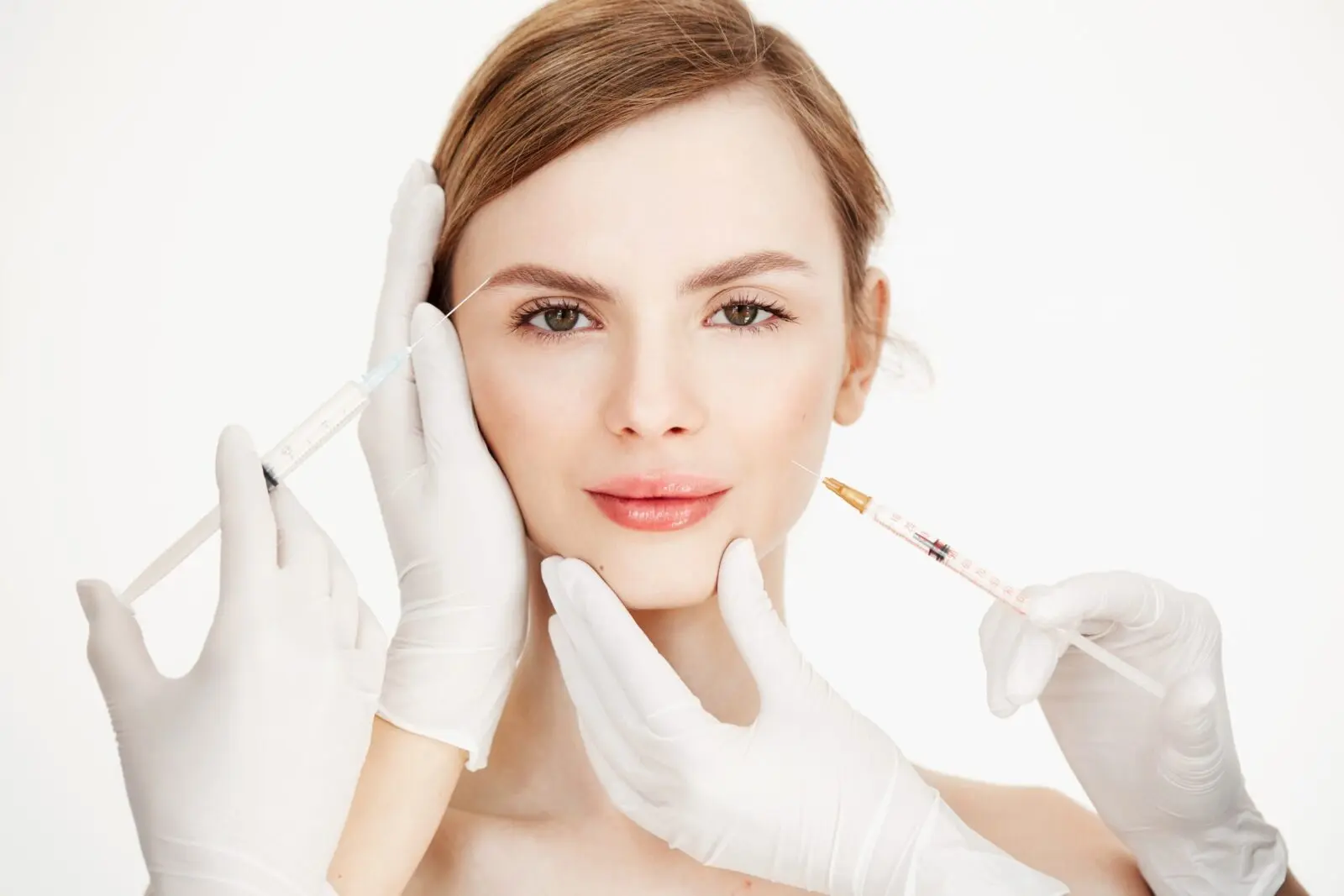Cosmetologists hands making medical botox injections to beautiful blonde. Skin lifting. Facial treatment. Beauty and spa. – Ц